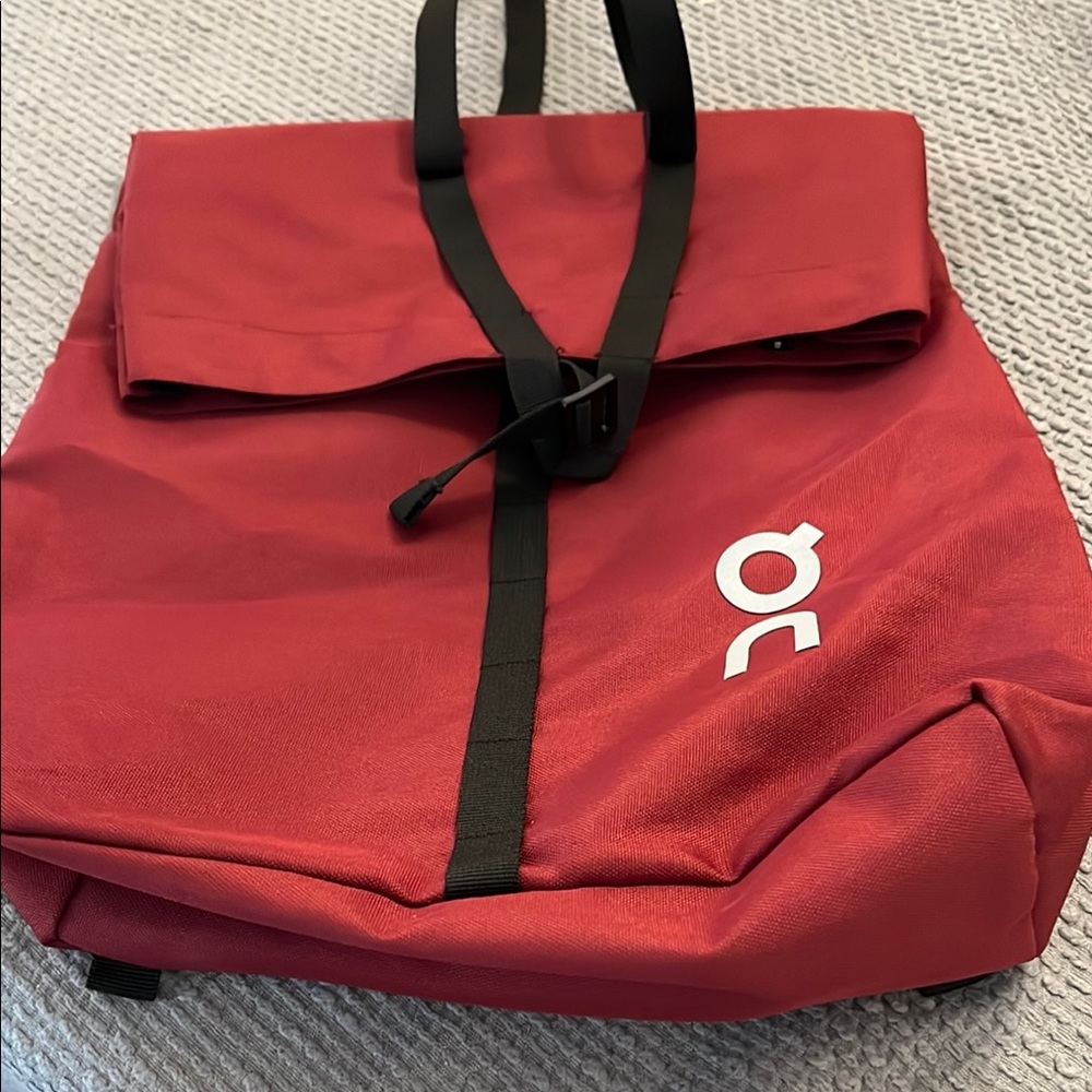 On Running Red and Black Backpack Minimalist Design